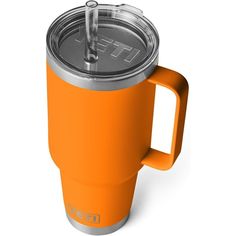 an orange yeti mug with a lid and straw in the cup is shown on a white background