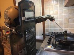 a man in camouflage cooking on top of a stove next to a frying pan