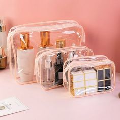 Description: This set of clear cosmetic bags includes three sizes: small (5.9 x 3.9 x 2.76 inches), medium (7.09 x 4.72 x 2.36 inches), and large (9.84 x 7.09 x 2.36 inches). Each bag features high-quality stainless steel double zippers for easy access to your travel essentials. The durable construction prevents tears and deformities, ensuring secure closure and long-lasting use. Crafted from double-layer transparent PVC plastic and waterproof fabric, these bags are both waterproof and easy to c Pvc Storage, Clear Toiletry Bag, Clear Cosmetic Bag, Clear Makeup Bags, Cosmetic Bag Set, Beg Tangan, Makeup Bag Organization, Transparent Bag, Beauty Case