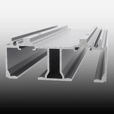 an assortment of metal beams on a gray background