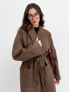 Elevate your winter wardrobe with our Chocolate Brown Women's Wrap Coat.  This stunning brown kimono jacket combines style and comfort, making it the perfect addition to your cold-weather attire.  Crafted from vegan wool, this wrap coat not only looks chic but is also a conscious choice for eco-friendly fashion lovers. Designed for warmth and versatility, this wrap wool long coat features a padded insulated lining composed of 30% wool and 70% polyester, ensuring you stay cozy during chilly days. Brown Long Sleeve Sweater Coat For Winter, Brown Lapel Collar Sweater Coat For Winter, Brown Sweater Coat With Pockets For Work, Long Belted Wool Coat For Fall, Belted Long Wool Coat For Fall, Long Brown Outerwear For Work, Oversized Brown Outerwear For Winter, Oversized Brown Winter Outerwear, Belted Wool Coat For Fall