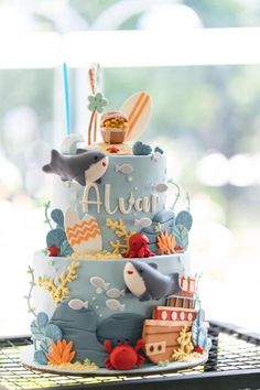 a three tiered cake with an ocean theme