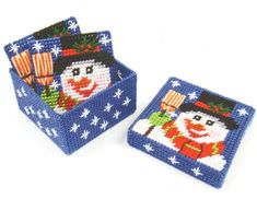 two small blue boxes with snowmen on them