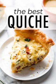 the best quiche recipe on a white plate with a cup of soup in the background