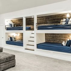 a living room filled with furniture and bunk beds