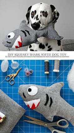 a dog is laying on the floor next to some sewing supplies and scissors, with his head resting on a shark pillow