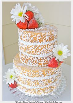 an image of a cake with strawberries on the top and flowers on the bottom