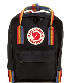 From Fjallraven&#x2C; the mini Kånken rainbow handle mini backpack features:VinylonIncludes seat pad stored in an inside pocket in the back of the main compartmentTwo open side pockets and one zippered pocket on the frontNam label inside main compartmentApprox. 29cm H x 20cm W x 13cm D; 7L volumeApprox. 0.485 lb weightImported.Special edition and part of the Artic Fox Initiative supporting climate/enviormental projects Fjallraven Kanken Rainbow, Black School Backpack With Logo Patch, Black Standard Backpack With Logo Patch, Black Backpack With Logo Patch, Black Travel Backpack With Logo Patch, Black Bag With Logo Patch For Outdoor Activities, Kanken Rainbow, Fjallraven Mini, Environmental Projects