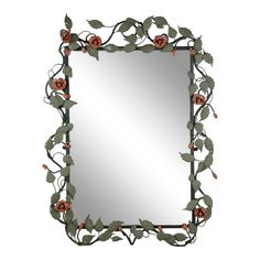 a mirror with roses on it and leaves around the edges, hanging from a wall