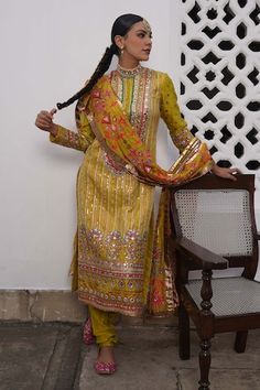 Yellow silk kurta with all over sequins, zardozi, zari, floral butti embroidery. Paired with a pant and dupatta with contrast embroidered buttis. - Aza Fashions Silk Kurta With Sequins For Festivals, Navratri Silk Traditional Wear With Sequins, Traditional Silk Wear With Sequins, Traditional Silk Sequined Wear, Silk Salwar Kameez With Sequins For Festivals, Traditional Silk Salwar Kameez With Sequins, Festive Silk Salwar Kameez With Sequins, Bollywood Style Silk Salwar Kameez With Sequins, Traditional Raw Silk Dupatta With Sequins