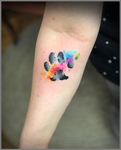 a colorful paw print on the arm