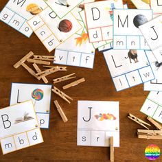 several different letter match cards on a table