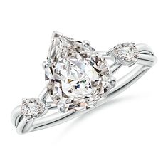 an oval cut diamond ring with three pear shaped diamonds on the shoulders and side stones, set in 18k white gold