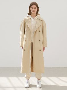 Editor's NotesThe overfit trench coat in rustling nylon has a classic lapel design featuring cow horn buttons with the Neueyet logo, double-button closure, waistbelt the same fabric, belt rings, and cuff button decorations. Also, it is unique with relaxed raglan sleeves and a round shoulder line, making it stylish to wear in spring and early fall. - Rustling nylon - Overfit- Classic lapel design- Double-button closure- Waistbelt the same fabric, belt rings, and cuff button decorat Oversized Classic Khaki Outerwear, Oversized Gabardine Outerwear For Fall, Oversized Beige Raincoat For Fall, Oversized Classic Gabardine Outerwear, Spring Oversized Gabardine Outerwear, Lapel Design, Belt Ring, Cow Horns, Button Decorations