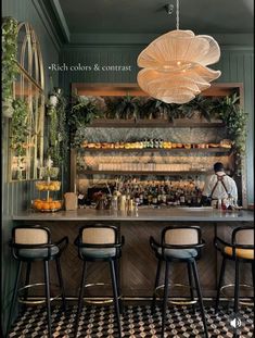 an image of a bar with stools in front of it