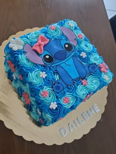 there is a cake that has been decorated with blue frosting