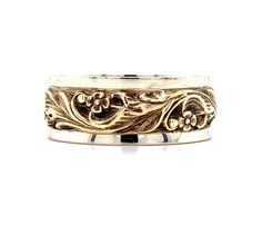 All of our jewelry is guaranteed authentic by our Graduate Gemologist of the Gemological Institute of America (GIA). 14k Yellow and White Gold Art Carved Floral Band (#J5592) 14k yellow and white gold flower eternity band. The white gold band has applied yellow gold flowers and leaves. The width of the band is 8mm. The ring fits a size 8 3/4 finger and it weighs 5.49 dwt. It dates from the 1950-60's. Fantastic!  SKU#J5592. 100% Satisfaction Guaranteed! Luxury Wide Band Jewelry With Decorative Band, Luxury 14k Gold Jewelry With Decorative Band, Luxury White Gold Jewelry With Decorative Band, Luxury Jewelry With Decorative Band In 14k Gold, Luxury Gold Jewelry With Decorative Band, Luxury Formal Jewelry With Decorative Band, Ornate 14k Stamped Jewelry For Formal Occasions, Traditional Yellow Gold Jewelry With Decorative Band, Luxury Engraved Wide Band Jewelry