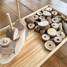 a wooden tray filled with lots of different types of wood