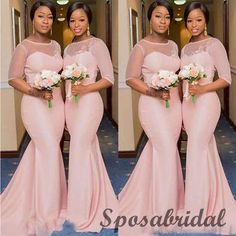 three women in pink dresses standing next to each other with flowers on their bouquets