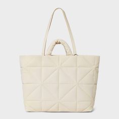 This Kate Tote Handbag from A New Day™ in a solid color showcases an unstructured silhouette with a geometric quilted finish for a chic, textured look and it goes well with any of your outfits. The interior accessories pocket, zip pocket and exterior side pockets help keep your belongings organized. Designed with a magnetic closure, this stylish tote handbag is easy to carry with double shoulder and grab handles. A New Day™: Style that goes wherever you do. Knitting Tote, Work Tote, Zip Tote, Tote Handbag, Nylon Bag, Christmas Wishlist, A New Day, Mommy And Me, Magnetic Closure