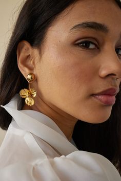 Gleam with sophistication wearing these classic Poppy Bauble Earrings. Handcrafted from 14 karat gold-plated domed studs, they feature an exquisite poppy flower design that evokes a modern, ethereal look. Perfect for any occasion, these earrings will add a touch of timeless luxury to your outfit. Hypoallergenic. Made to order. Elegant Formal Earrings With Flower Charm, Elegant Yellow Gold Clip-on Flower Earrings, Gold Plated Flower Earrings For Formal Occasions, Elegant Gold-plated Flower Charm Earrings, Formal Gold Plated Flower Earrings, Elegant Gold Plated Flower Earrings, Elegant Gold Plated Flower Earrings For Formal Occasions, Elegant Gold-plated Flower Earrings For Formal Occasions, Elegant Gold-plated Flower Earrings For Formal Events