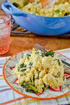 a plate with rice and broccoli on it