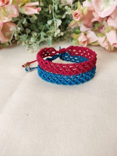 Macrame Bracelet set of 2, made with fine quality waxed thread, in bright red and blue color. Water and sun resistant. These bracelets fit all wrist sizes with an adjustable sliding knot closure. For women with unique and alternative style. Dimension : 0,3" Blue Macrame Friendship Bracelets For Festival, Blue Macrame Bracelets For Festival, Red Macrame Jewelry For Beach, Handmade Red Adjustable Friendship Bracelets, Red Beaded Bracelets With Sliding Knot For Beach, Red Adjustable Friendship Bracelets, Adjustable Red Bracelet For Beach, Red Adjustable Braided Waxed Cord Bracelets, Red Waxed Cord Friendship Bracelets