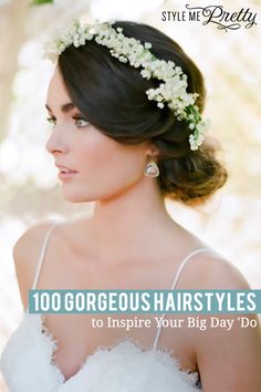 a woman with flowers in her hair wearing a white dress