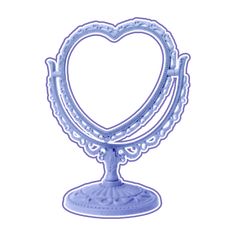 a blue heart shaped candle holder on a white background