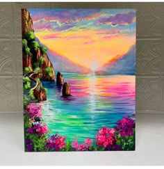 an oil painting on canvas of a beautiful sunset over the ocean with flowers and rocks