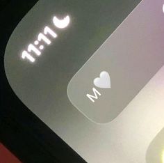 an image of a keyboard with the word m and heart sticker on it's left side