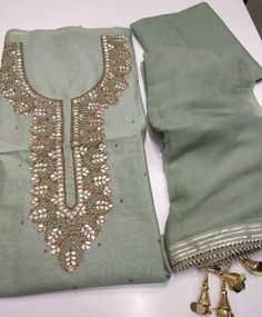 Item Overview Atharva Hand Embroidered Salwar Kameez w/beautiful Embroidered Neck Pista Green & elegant Sadowski work Chiffon Chinnon Dupatta. Dno -CH1203 Fabric: * Shirt Chanderi Silk - Green Pista - 2.5 Mts, * Dupatta: Chiffon Chinon Dupatta Green (Pista) w/ Gota Sadowski Work Dupatta. 2.5 Mts * Bottom Santoon Silk 2.5 Mts. Excusive Hand Embroidered Party Wear Punjabi Suit. Customization: * Fabrics: Designs Can be made in different Fabrics. * Stitching Available Care: * Dry Clean/ Avoid direct Elegant Lawn Suit With Mirror Work For Navratri, Pista Green Georgette Kurta With Mirror Work, Elegant Green Lawn Suit With Mirror Work, Semi-stitched Kurta With Mirror Work In Georgette, Semi-stitched Georgette Kurta With Mirror Work, Semi-stitched Pista Green Salwar Kameez With Mirror Work, Green Georgette Unstitched Suit With Mirror Work, Pista Green Chinon Salwar Kameez With Mirror Work, Elegant Pista Green Salwar Kameez With Dabka Work