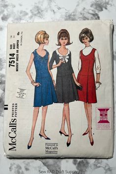 two women's dress patterns, one in blue and the other in red