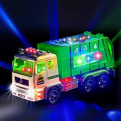 a toy truck with lights on the front and back is lit up in blue light