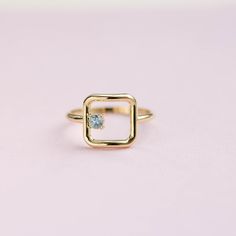 An open square ring in 14K solid gold with a natural aquamarine gemstone. A minimalist geometric ring for women for everyday use and a great gift for her by Kyklos Jewelry. ● Metal: 14K solid gold, 14K white gold  ● Square Dimensions: 11mm x 11 mm ● Gemstone: Aquamarine 0.11ct ● Choose from the drop down menus the available options (Material, Ring size) and leave us a note for any special requirements. ● All our pieces are delivered beautifully packaged and gift ready.  ● Please keep in mind tha Gold Ring For Women, Stacker Rings, Square Ring, Solid Gold Ring, Jewelry Metal, Geometric Ring, Orange Sapphire, Square Rings, Solid Gold Rings