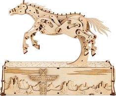 a wooden sculpture of a horse on top of a box