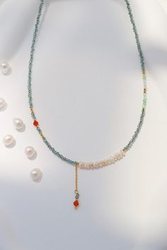 This delicate and vibrant necklace made of shimmering turquoise color beads, freshwater pearls, and gold accents adding a touch of summer accent to your wardrobe. Perfect as a thoughtful gift for anyone who loves jewelry that stands out with its vibrant yet elegant design. Treat yourself or someone special to this beautifully crafted piece! Details 3mm freshwater pearl 3mm CZ ruby gemstone 2mm Turquoise color metal plastic beads 40+5cm necklace chain with extender Turquoise Choker, Turquoise Crystal, Crystal Bead Necklace, Necklace Turquoise, Natural Pearl, Ruby Gemstone, Plastic Beads, Turquoise Color, Natural Pearls