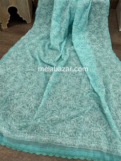 Beautiful and lightweight Chikankari hand embroidered geoDupatta with crochet lace. Bohemian Green Dupatta With Chikankari Embroidery, Bohemian Green Chikankari Embroidered Dupatta, Unstitched Chikankari Embroidered Lace Fabric, Blue Chikankari Embroidered Georgette Fabric, Unstitched Lace Fabric With Chikankari Embroidery, Bohemian Mulmul Dupatta With Chikankari Embroidery, Bohemian Dupatta With Chikankari Embroidery, Lace Fabric With Chikankari Embroidery For Eid, Bohemian Resham Embroidered Georgette Fabric