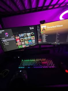 two computer monitors sitting next to each other in front of a keyboard and mouse on a desk