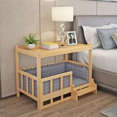 a bed room with a neatly made bed and a night stand on the side table