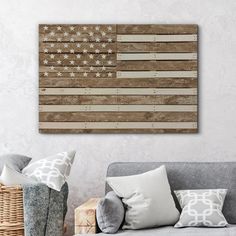 an american flag made out of wooden planks on a wall in a living room