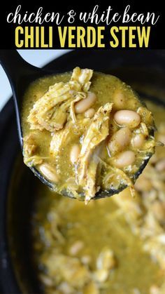 chicken and white bean chili verde stew in a black crock pot with a spoon