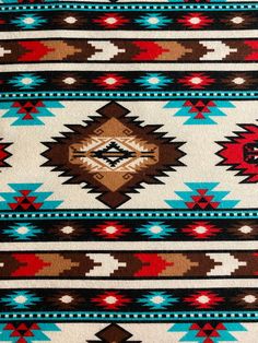 an old navajo rug with red, white and blue designs on the front end is shown