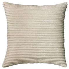 a white pillow with pleated lines on the front and back, against a white background