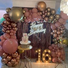 a birthday party with balloons, cake and decorations