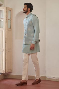 Blue silk bundi with thread and sequins embroidery. - Aza Fashions Fitted Nehru Jacket With Zari Work For Spring, Fitted Chanderi Nehru Jacket For Spring, Spring Fitted Nehru Jacket In Chanderi, Traditional Nehru Jacket For Spring Reception, Traditional Nehru Jacket For Reception In Spring, Spring Nehru Jacket With Chikankari Embroidery In Cotton Silk, Spring Cotton Silk Nehru Jacket With Chikankari Embroidery, Designer Nehru Jacket With Cutdana For Spring, Blue Chanderi Nehru Jacket For Designer Wear