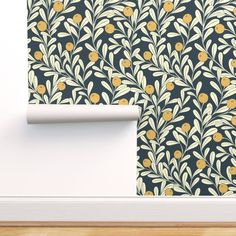 an image of a wallpaper with flowers and leaves in the background on a wooden floor