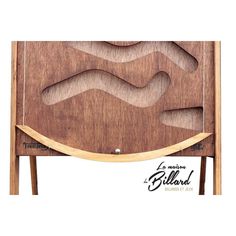 a wooden table with an abstract design on the top and bottom part, made out of wood