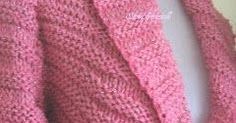 a close up of a pink sweater on a mannequin