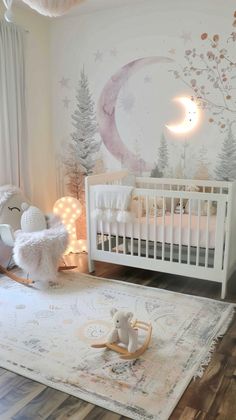 a baby's room decorated in pink and white